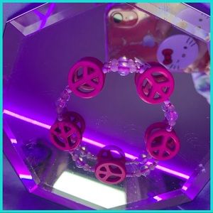 Handmade pink peace sign bracelet